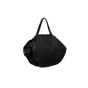 Shupatto packable bag showing the integrated drawstring pouch