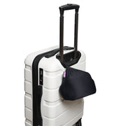 Cabeau Evolution Earth Deluxe Travel Pillow travel case on a suitcase handle