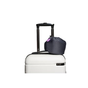 Cabeau Evolution Plus Travel Pillow travel case clipped to a suitcase handle